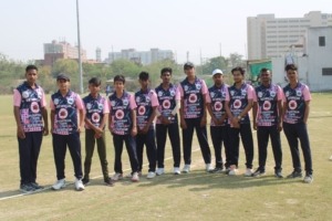 Cricket team standing together for a group photo