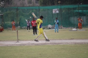 Cricketer hitting a shot during the match