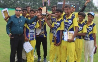 Cricket team posing with medals and certificates"