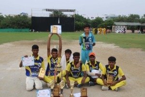 Cricket champions standing together holding the winners’ trophy