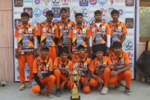 Winning cricket team posing with the trophy