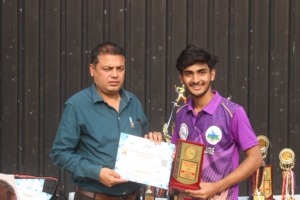 Young player showing certificate
