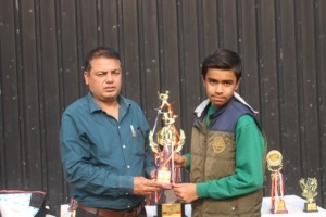 Young player showing certificate