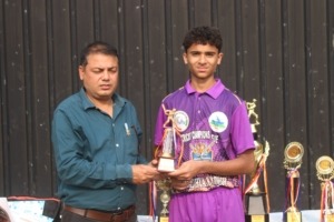 Young player showing certificate