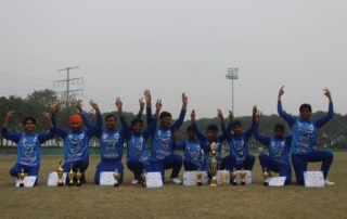 Group photo with trophy and certificates