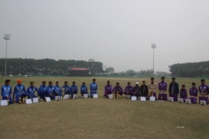 Team standing and sitting with awards